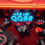 Experience high-stakes action at nhà cái qq88, where players engage at roulette and poker tables amid a dazzling casino backdrop.
